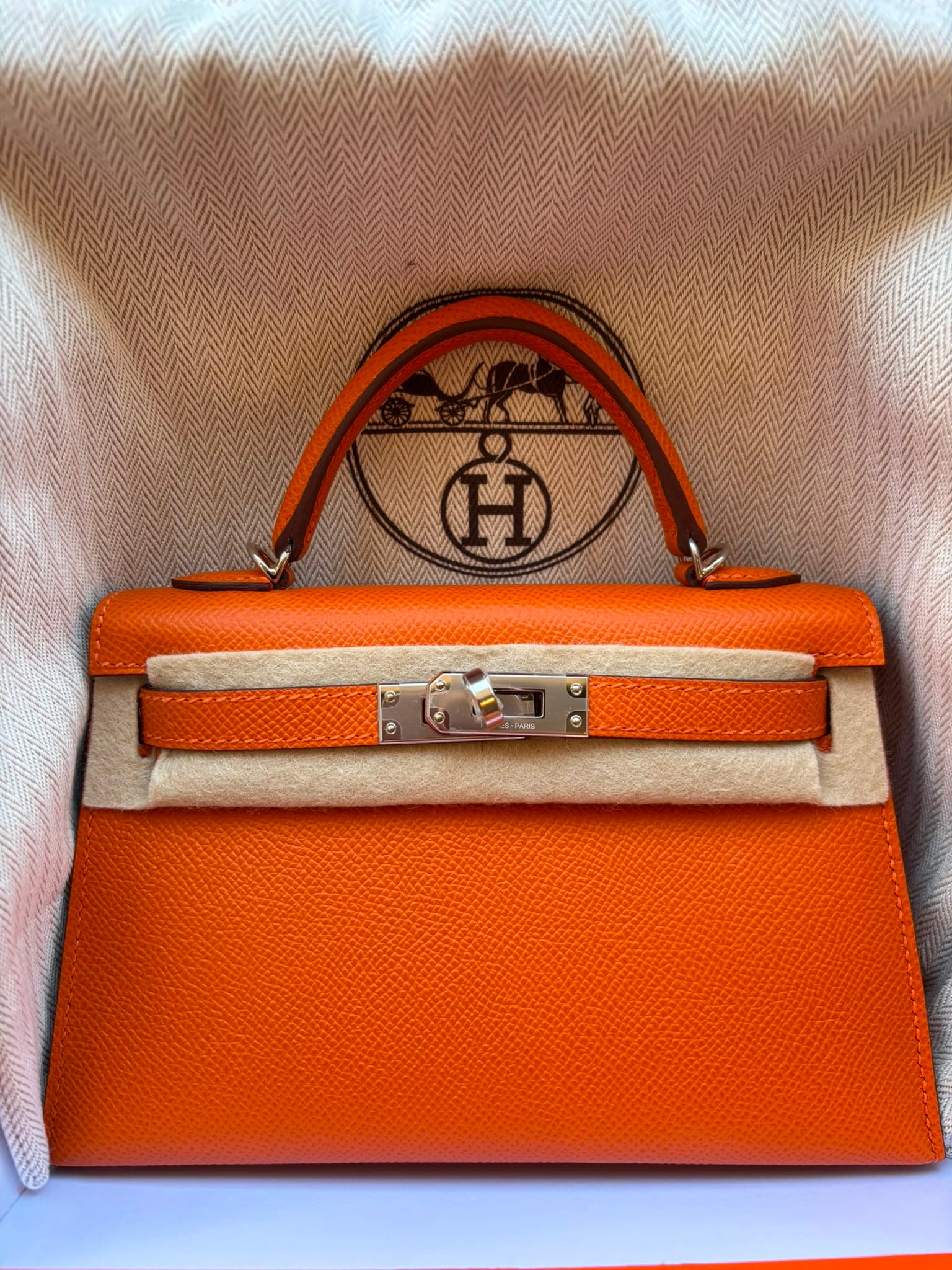 Hermès Mini Kelly Mini in Orange Epsom Palladium (PHW) hardware — front view
