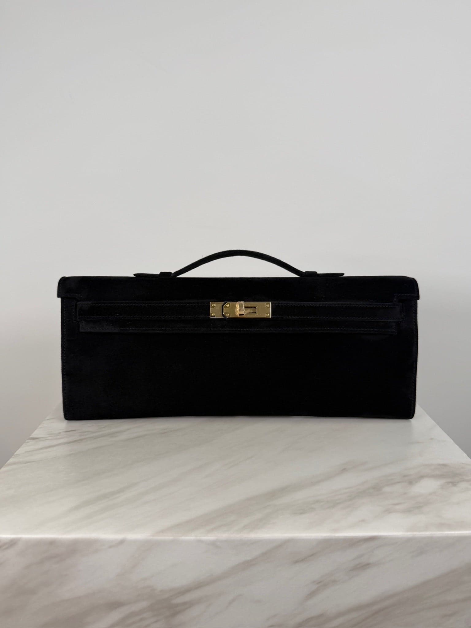 Hermès Kelly Cut Cut in Black Doblis Permabrass Hardware hardware — front view