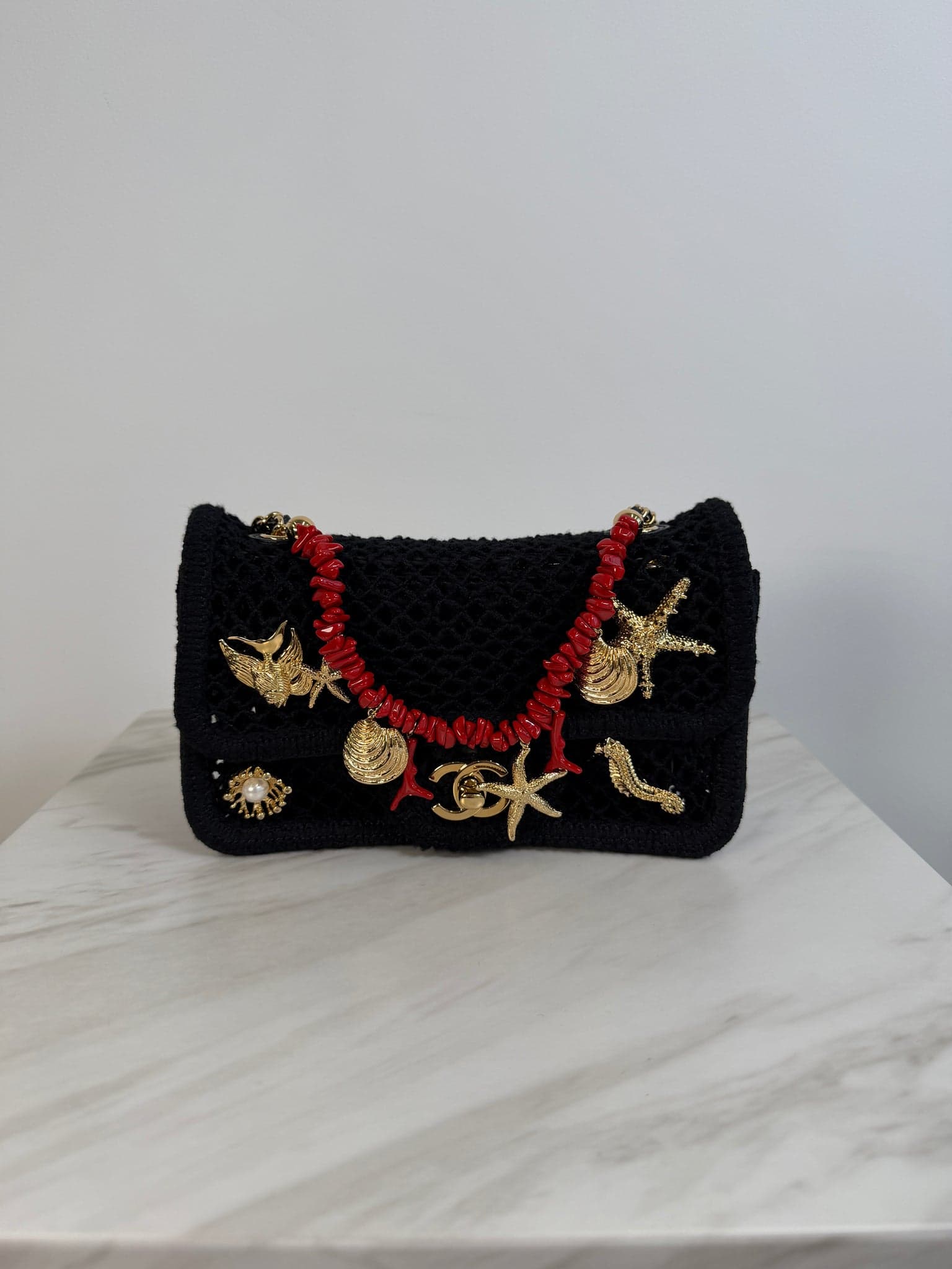 Hermès Coco Beach 2026 Mini Flapbag Mini in Black Mesh Gold Tone Metal hardware — front view