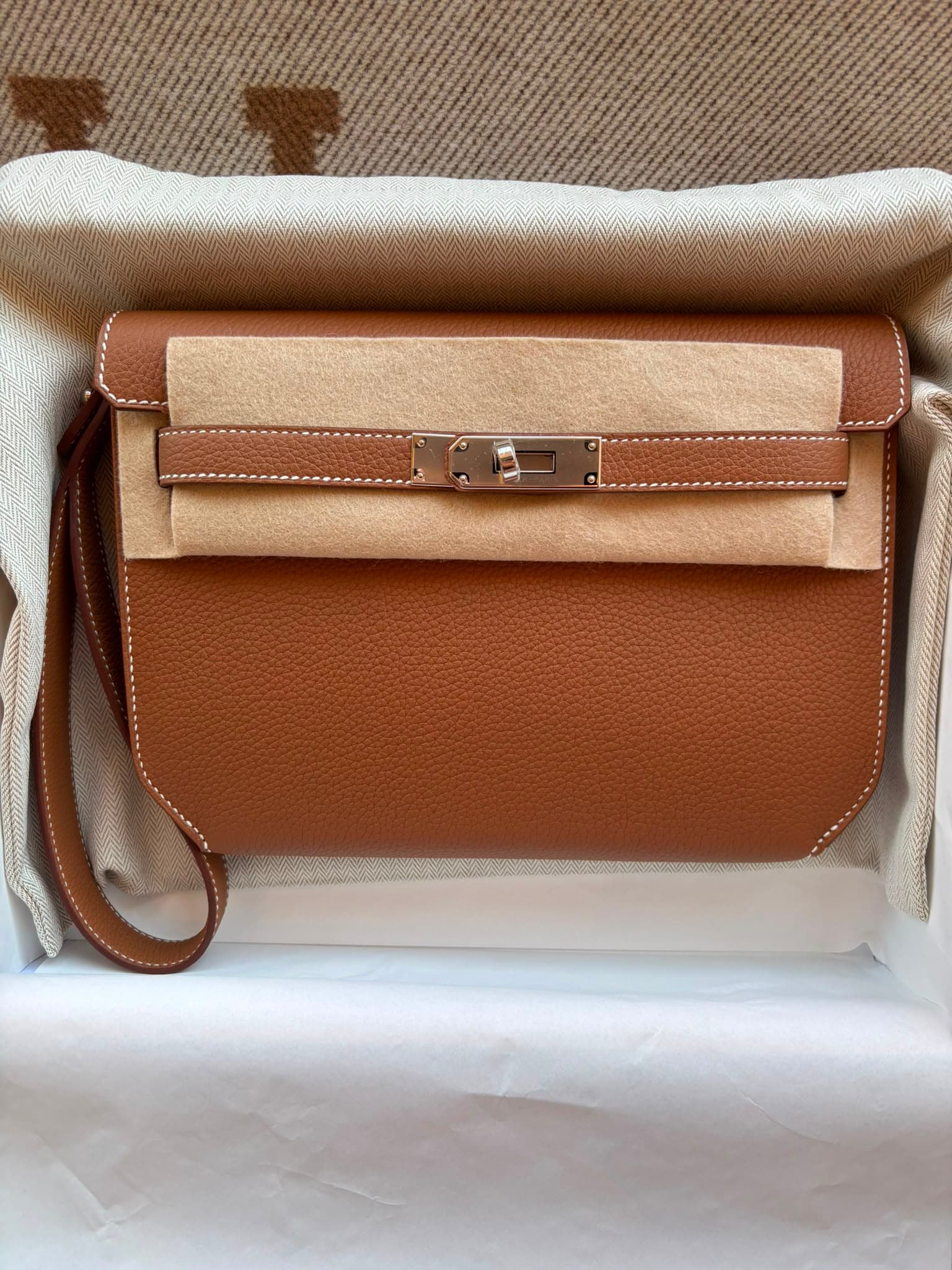 Hermès Kelly Depeches in Gold Togo Palladium (PHW) hardware — front view