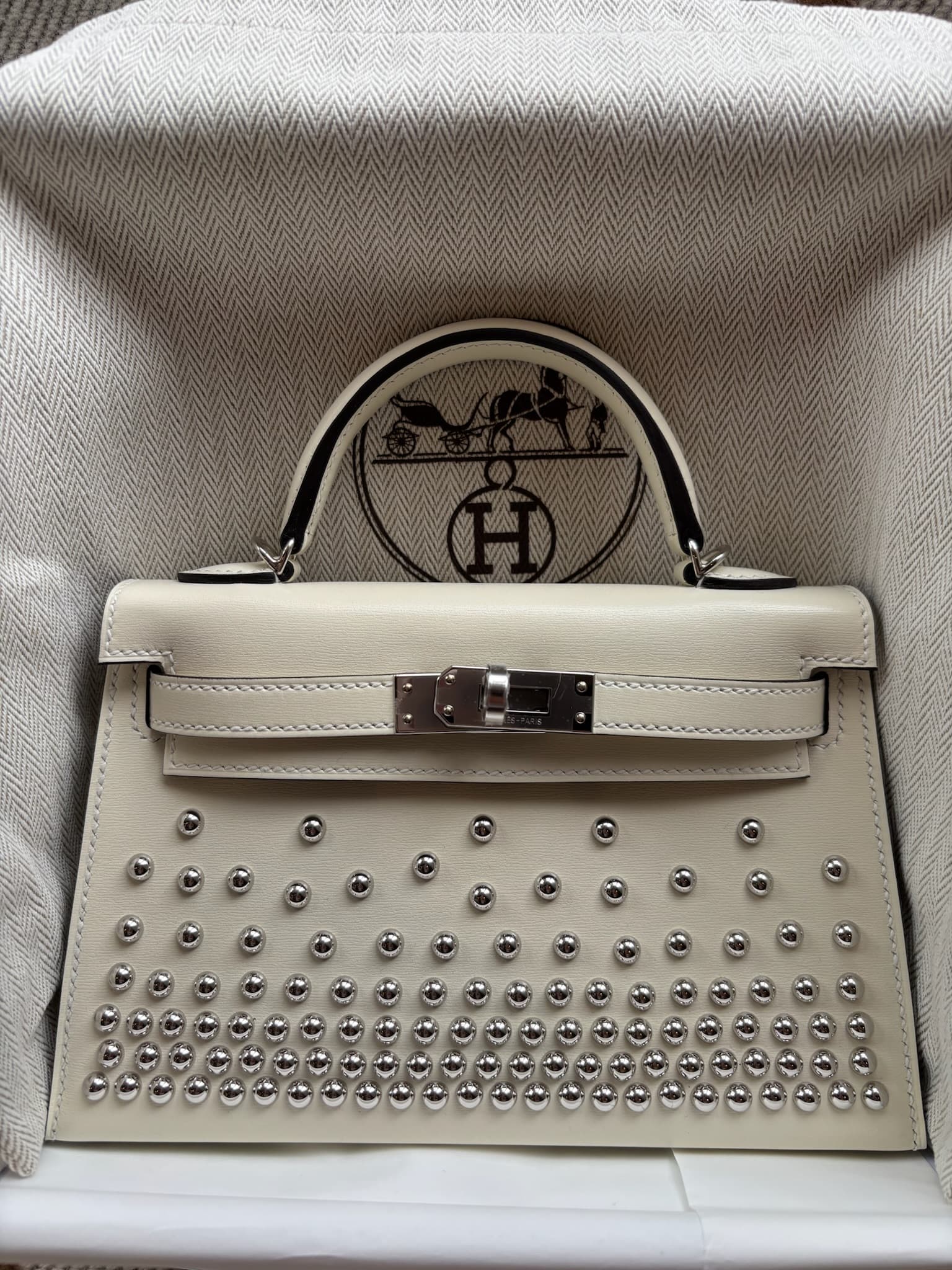 Hermès Mini Kelly Clouté Mini in Nata Other Palladium (PHW) hardware — front view