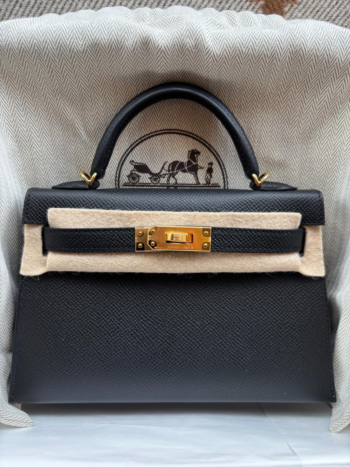 Hermès Kelly Mini in Black Epsom GHW hardware — front view