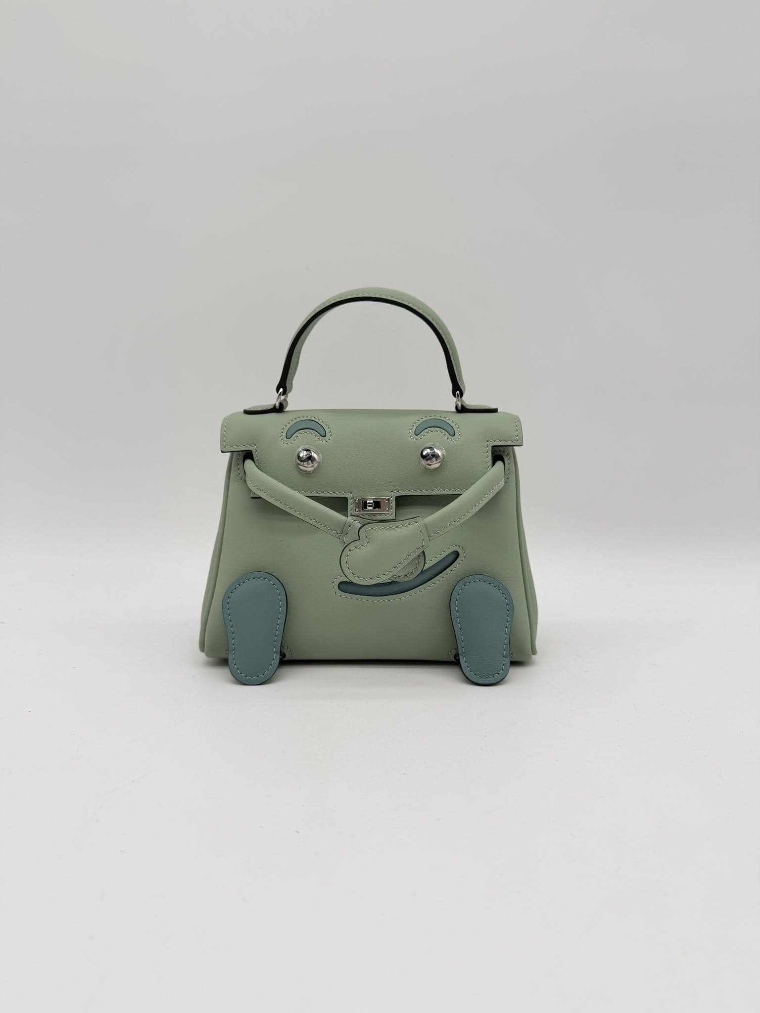 Hermès Kelly Doll in Vert D'eau/ Ciel Swift Palladium (PHW) hardware — front view