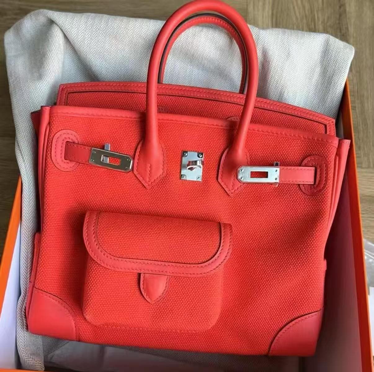 Hermès Birkin 25 in Orange Feu Togo PHW hardware — front view