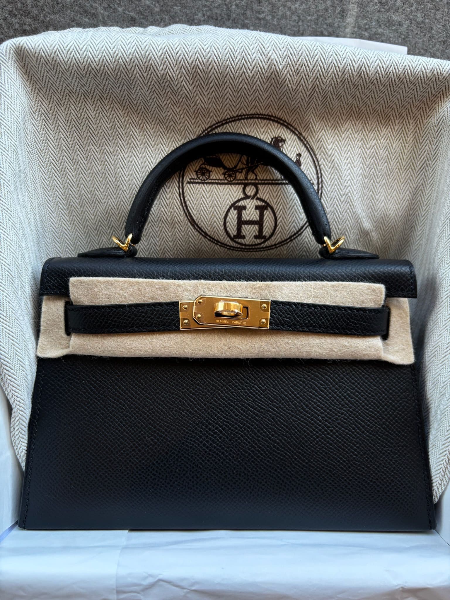Hermès Kelly Mini in Black Epsom GHW hardware — front view