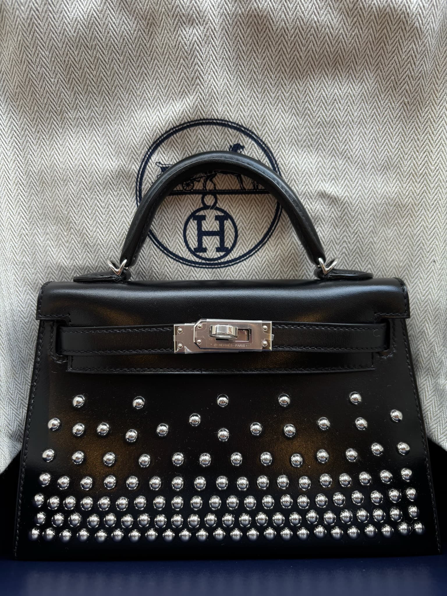 Hermès Mini Kelly Clouté Mini in Black Box Calf PHW hardware — front view