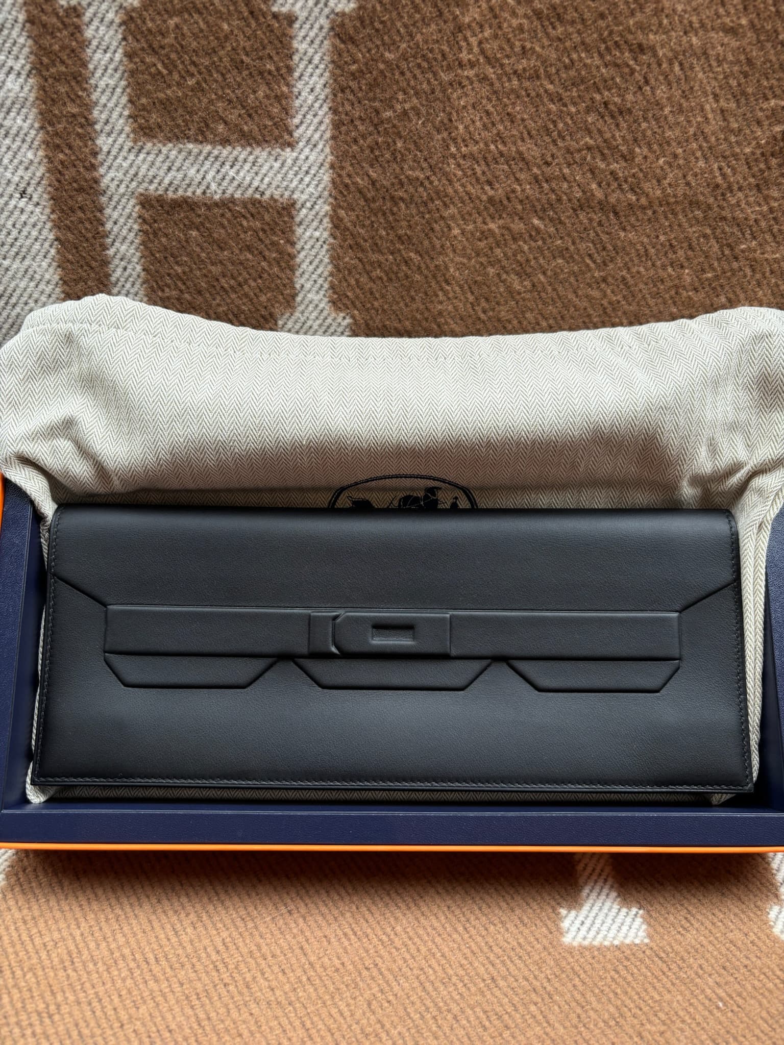 Hermès Shadow Clutch in Black Exotic GHW hardware — front view