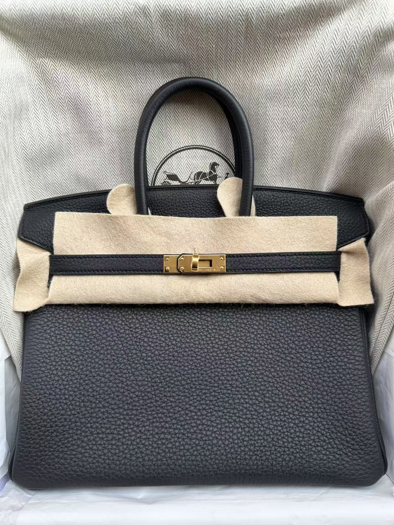 Hermès Birkin 25 in Black and Bleu Saphir Togo GHW hardware — front view