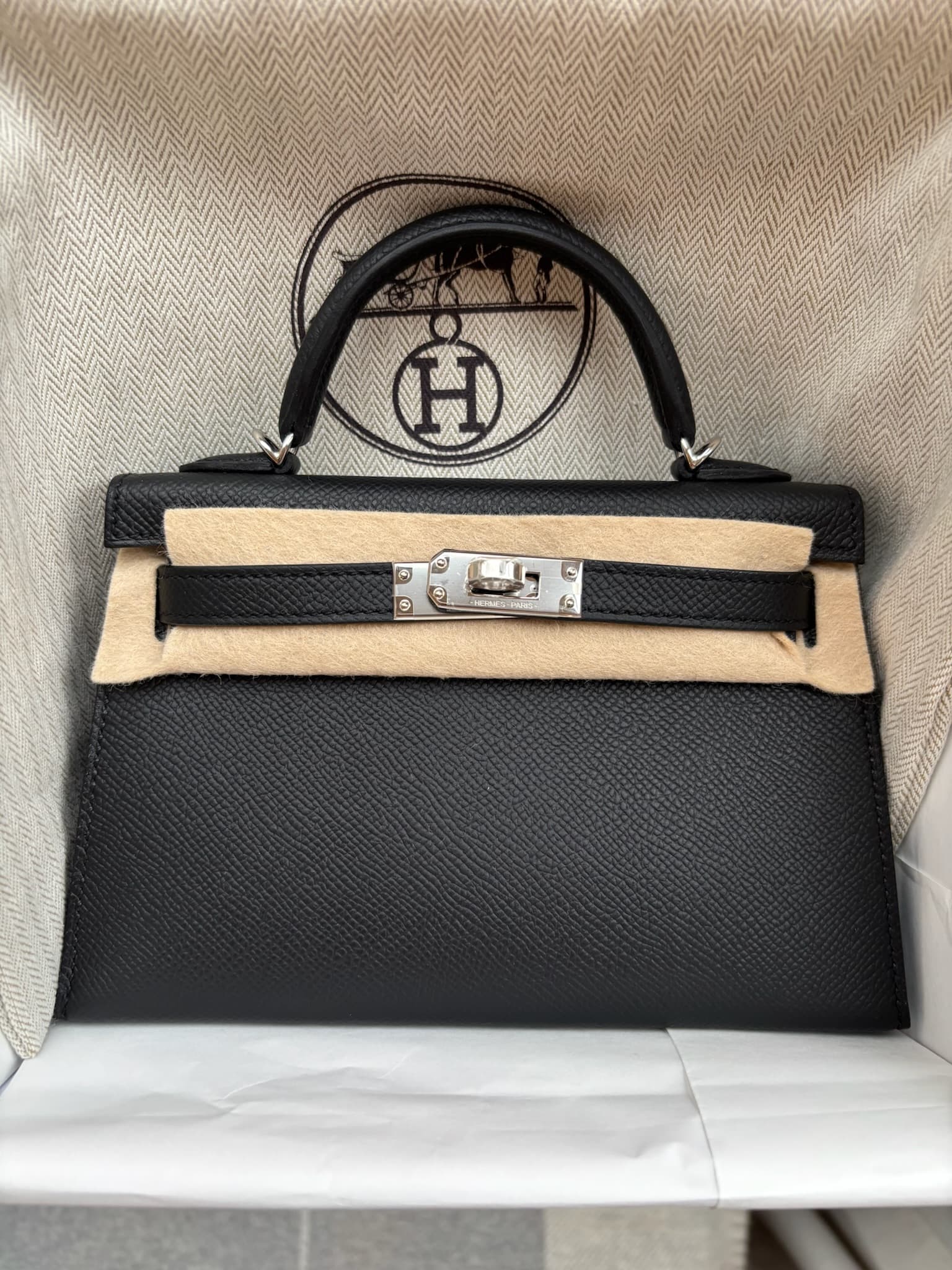Hermès Kelly Mini in Black Epsom PHW hardware — front view